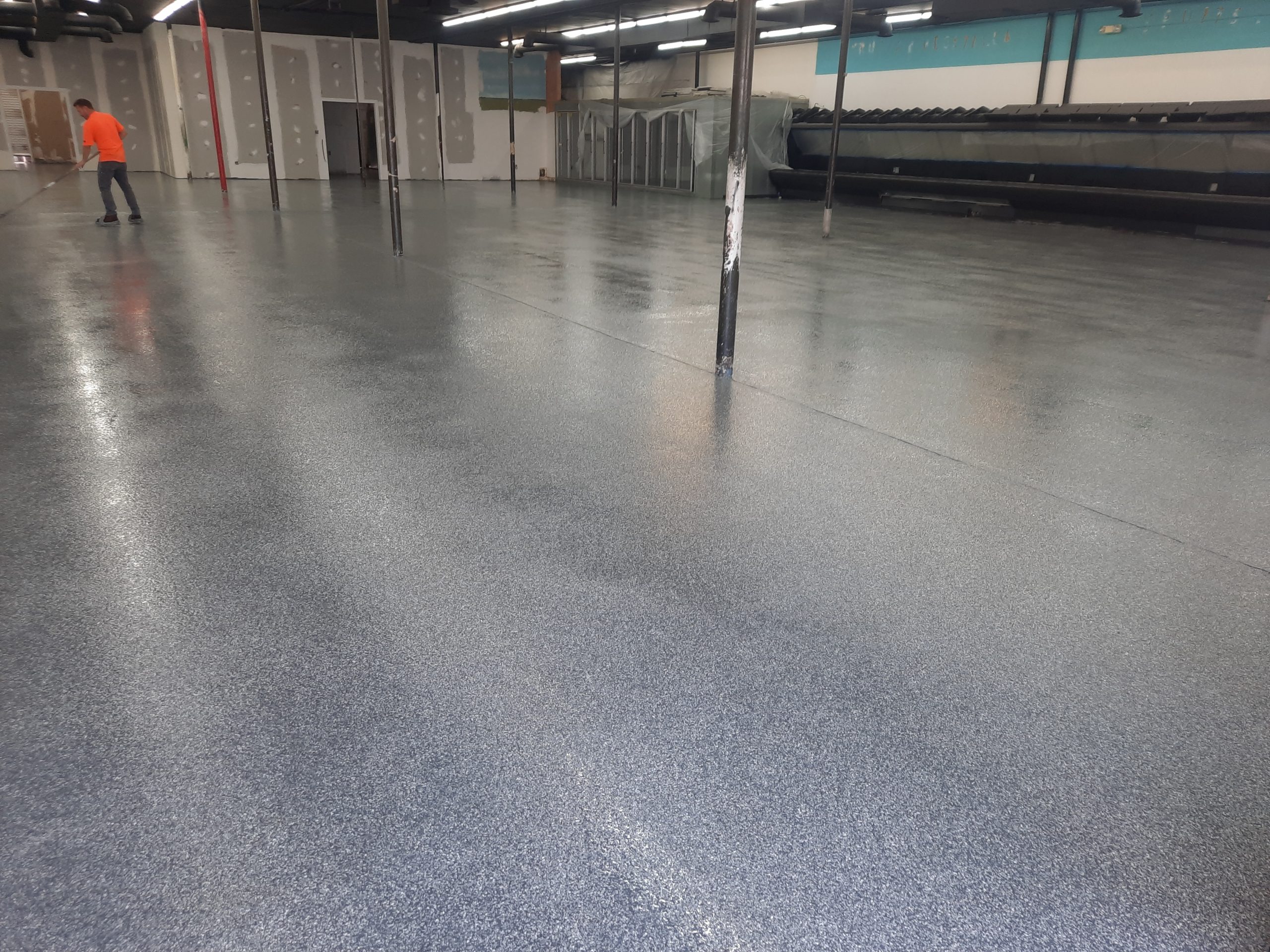 Fresh epoxy floor coating curing inside a Utah commercial space