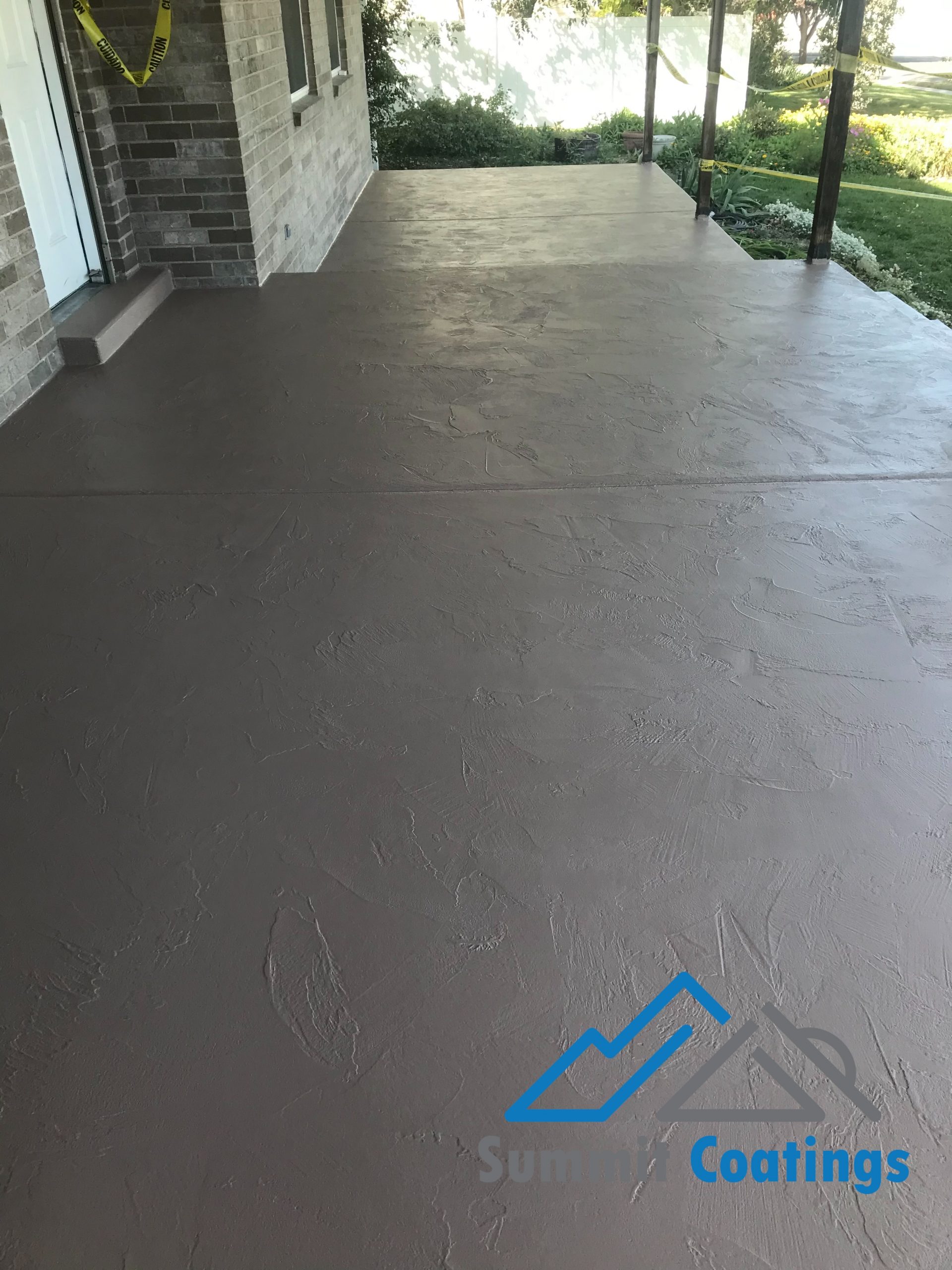 Finished waterproof deck coating on a Utah porch